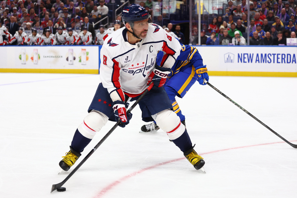 Washington Capitals left wing Alex Ovechkin (8) controls the puck during the second period of an NHL hockey game against the Buffalo Sabres Saturday, Nov. 1, 2025, in Buffalo, N.Y. (AP Photo/Jeffrey T. Barnes)