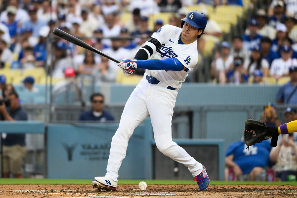 Los Angeles Dodgers' Shohei Ohtani hits a ground ball during the fifth inning of a baseball game against the Arizona Diamondbacks in Los Angeles, Sunday, July 12, 2026. (AP Photo/Kyusung Gong)