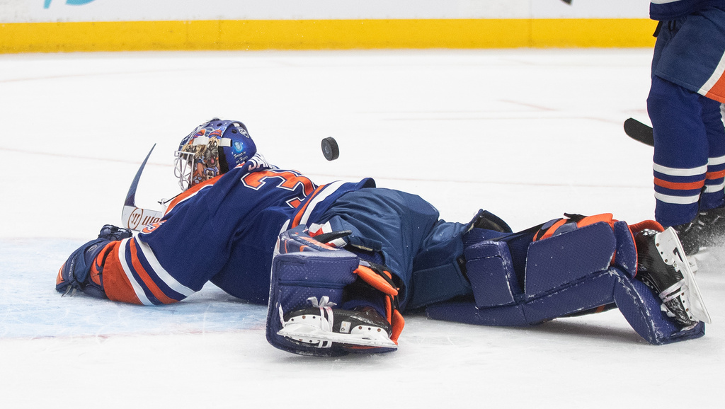 Edmonton Oilers goalie Tristan Jarry makes a save during first-period NHL hockey game action against the Anaheim Ducks in Edmonton, Alberta, Monday, Jan. 26, 2026. (Jason Franson/The Canadian Press via AP)