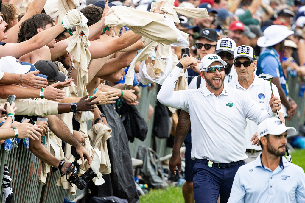 FILE - Dean Burmester, of Southern Guards GC, celebrates with the fans on the 17th hole during the third round of LIV Golf South Africa at The Club at Steyn City, March 21, 2026 in Midrand, South Africa. (Jon Ferrey/LIV Golf via AP, File)