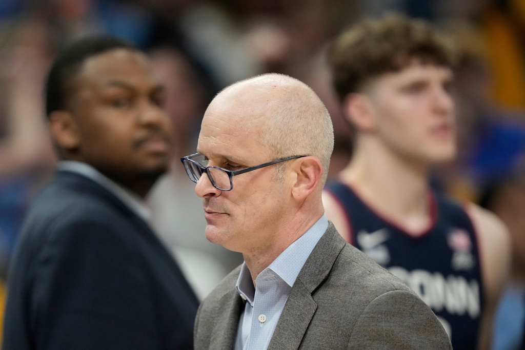 UConn head coach Dan Hurley exits the court after being ejected during an NCAA college basketball game against Marquette, Saturday, March 7, 2026, in Milwaukee. (AP Photo/Aaron Gash)