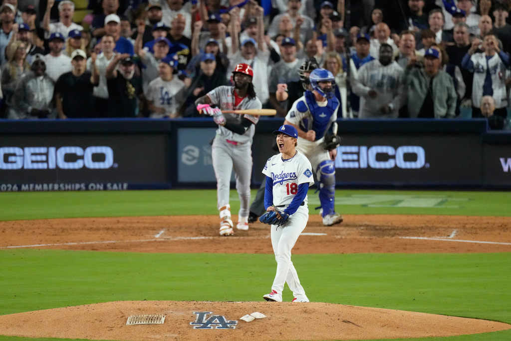 Los Angeles Dodgers pitcher Yoshinobu Yamamoto reacts after striking out Cincinnati Reds' Elly De La Cruz during the sixth inning in Game 2 of the National League Wild Card baseball playoff series Wednesday, Oct. 1, 2025, in Los Angeles. (AP Photo/Mark J. Terrill)