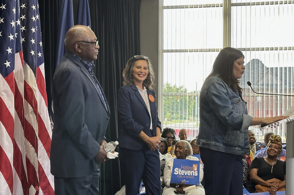 U.S. Rep. James Clyburn, D-S.C., left, and Michigan Gov. Gretchen Whitmer, center, appear at a rally Friday, July 24, 2026, in Detroit, to support Democratic Senate candidate Haley Stevens. (AP Photo/Ed White)