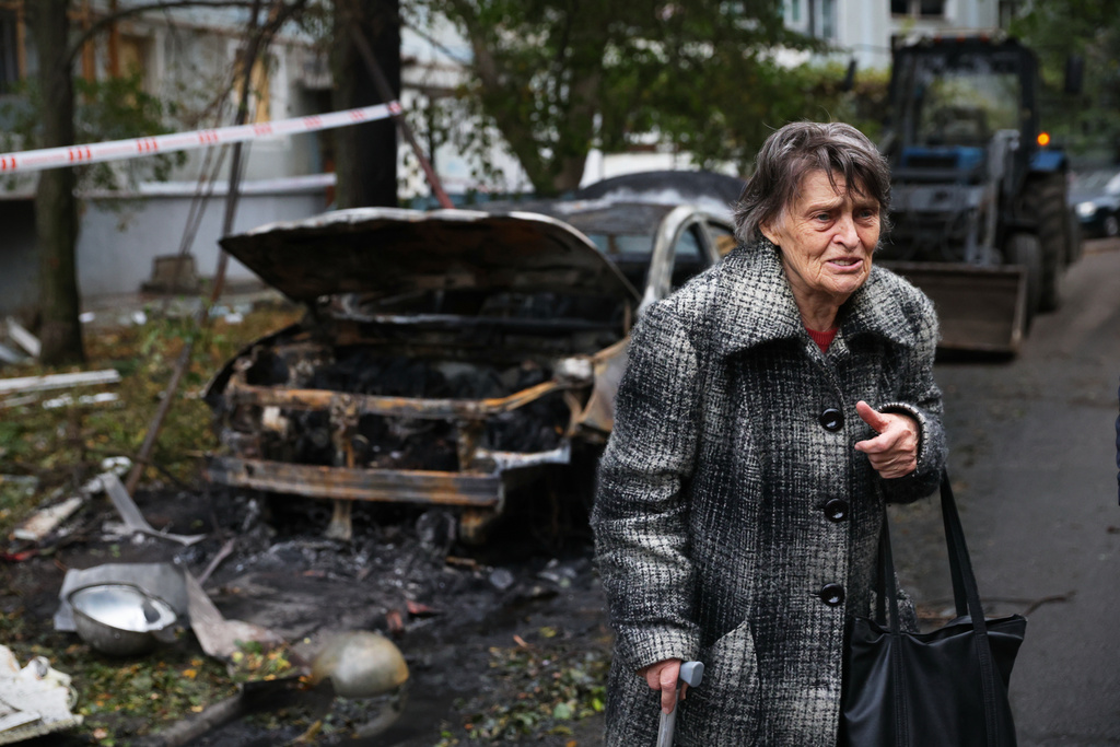 An elderly woman reacts next to the house destroyed by a Russian strike in Zaporizhzhia, Ukraine, Sunday, Oct. 5, 2025. (AP Photo/Kateryna Klochko)