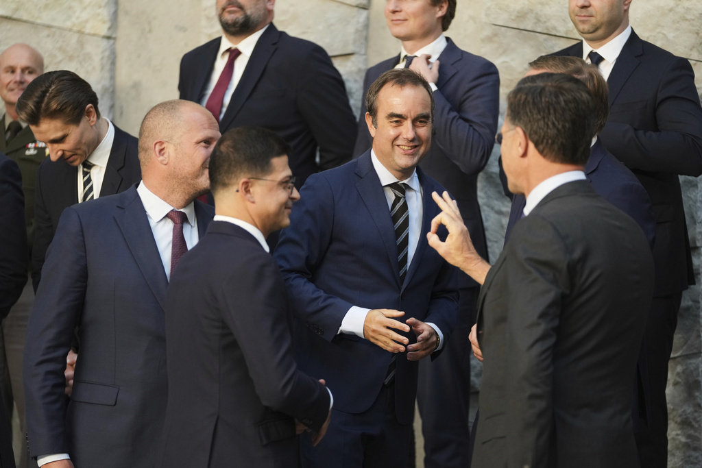 FILE - French Defense Minister Sebastien Lecornu, center, speaks with NATO Secretary General Mark Rutte, second right, during a group photo of NATO defense ministers at NATO headquarters in Brussels, June 5, 2025. (AP Photo/Virginia Mayo, File)