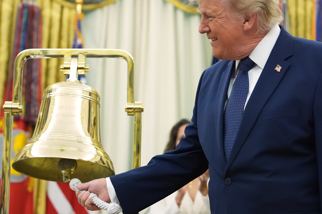 President Donald Trump rings the opening bell for the New York Stock Exchange and the Nasdaq in the Oval Office at the White House, Monday, July 6, 2026, in Washington. (AP Photo/Mark Schiefelbein)