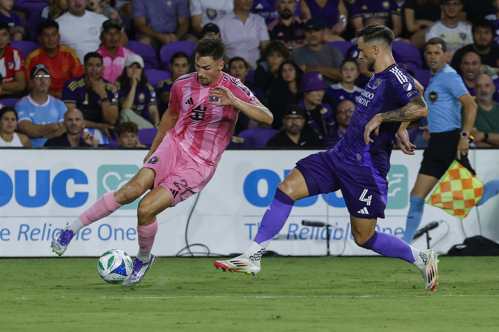 Inter Miami forward Tadeo Allende, left, is defended by Orlando City defender David Brekalo (4) during the first half of an MLS soccer match, Sunday, Aug. 10, 2025, in Orlando, Fla. (AP Photo/Kevin Kolczynski)