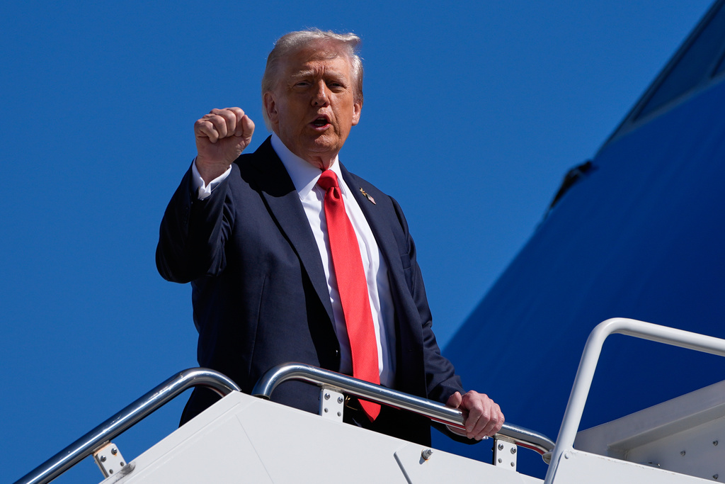 President Donald Trump gestures as he boards Air Force One, Sunday, Oct. 5, 2025, at Joint Base Andrews, Md., en route to Norfolk, Va. (AP Photo/Alex Brandon)