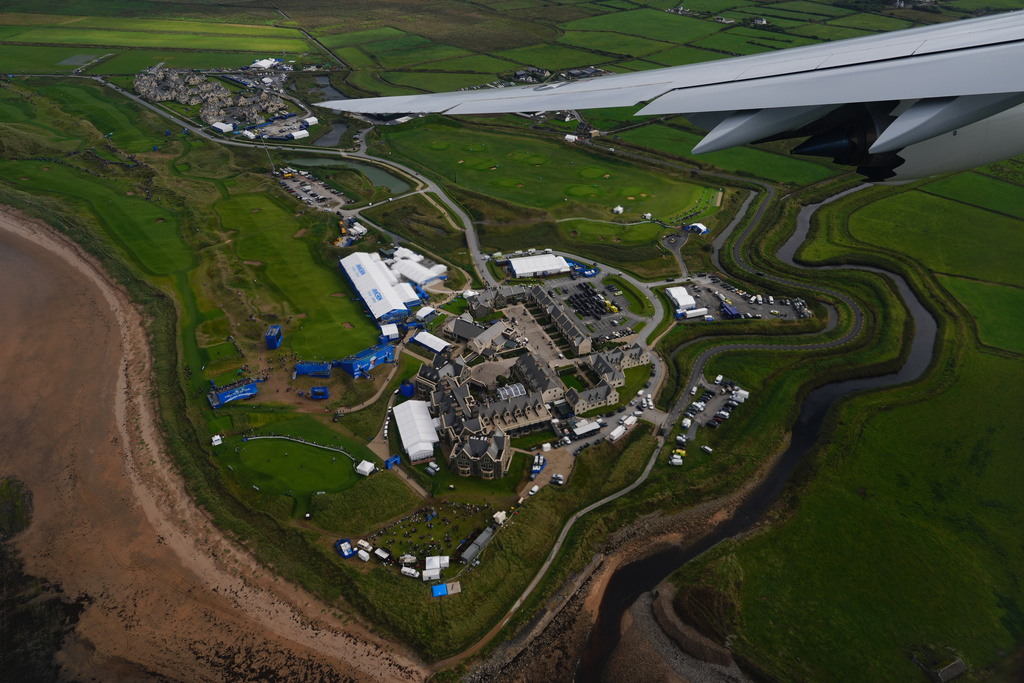 Air Force One flies over the site of the Irish Open golf tournament at Trump International Golf Links in Doonbeg, County Clare, on its way to Shannon Airport in Shannon, Ireland, Saturday, Sept. 12, 2026. (AP Photo/Julia Demaree Nikhinson)