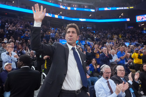 FILE - Former Golden State Warriors general manager Bob Myers waves while being honored during the first half of an NBA basketball game between the Warriors and the Milwaukee Bucks in San Francisco, Wednesday, March 6, 2024. (AP Photo/Jeff Chiu, File) FILE - Former Golden State Warriors general manager Bob Myers waves while being honored during the first half of an NBA basketball game between the Warriors and the Milwaukee Bucks in San Francisco, Wednesday, March 6, 2024. (AP Photo/Jeff Chiu, File)