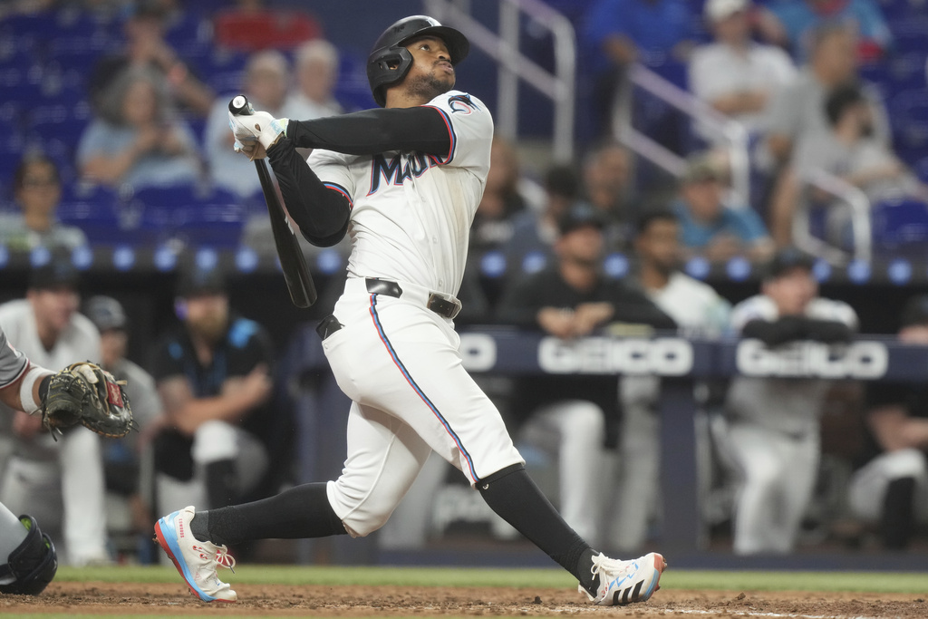 Miami Marlins' Xavier Edwards hits a three-run home run during the eighth inning of a baseball game against the Washington Nationals Wednesday, Sept. 10, 2025, in Miami. (AP Photo/Marta Lavandier)