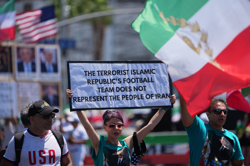 People protest outside Los Angeles Stadium before the World Cup Group G soccer match between Iran and New Zealand in Inglewood, Calif., near Los Angeles, Monday, June 15, 2026. (AP Photo/Jae C. Hong)