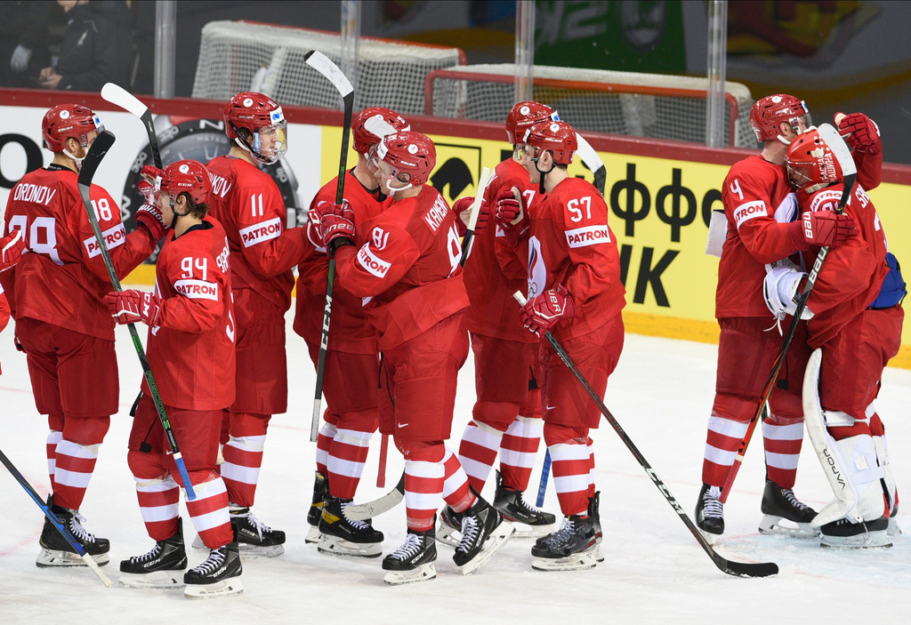 FILE - Team of Russia players celebrate during the Ice Hockey World Championship group A match between the Russia and Czech Republic at the Olympic Sports Center in Riga, Latvia, May 21, 2021. (AP Photo/Oksana Dzadan, File)