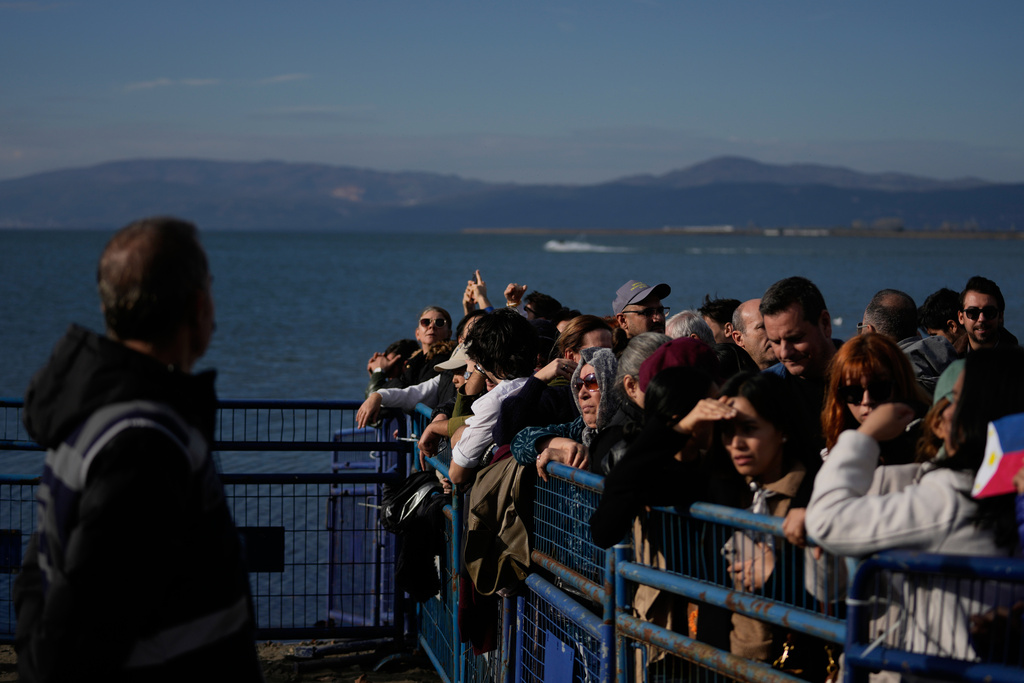 People gather before the arrival of Pope Leo XIV to the archaeological excavations of the ancient Byzantine-era Christian Saint Neophytos Basilica, in Iznik, Turkey, Friday, Nov. 28, 2025. (AP Photo/Khalil Hamra)
