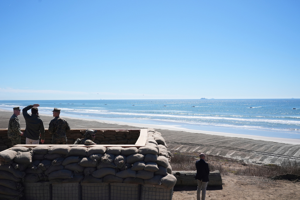 Vice President JD Vance, second left, watches a demonstration by Marines during activities to mark the upcoming Marine Corps' 250th anniversary Saturday, Oct 18, 2025, on Marine Corps Base Camp Pendleton in Camp Pendleton, Calif. (AP Photo/Gregory Bull)