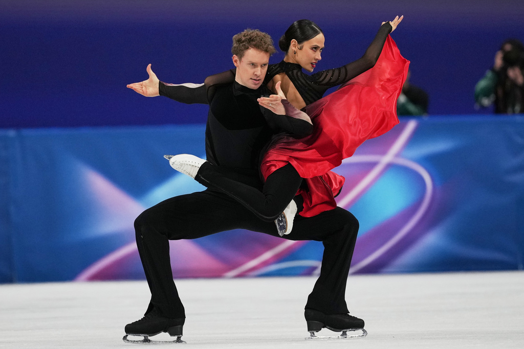 Madison Chock and Evan Bates of the United States compete during the ice dancing free skate in figure skating at the 2026 Winter Olympics, in Milan, Italy, Wednesday, Feb. 11, 2026. (AP Photo/Francisco Seco)