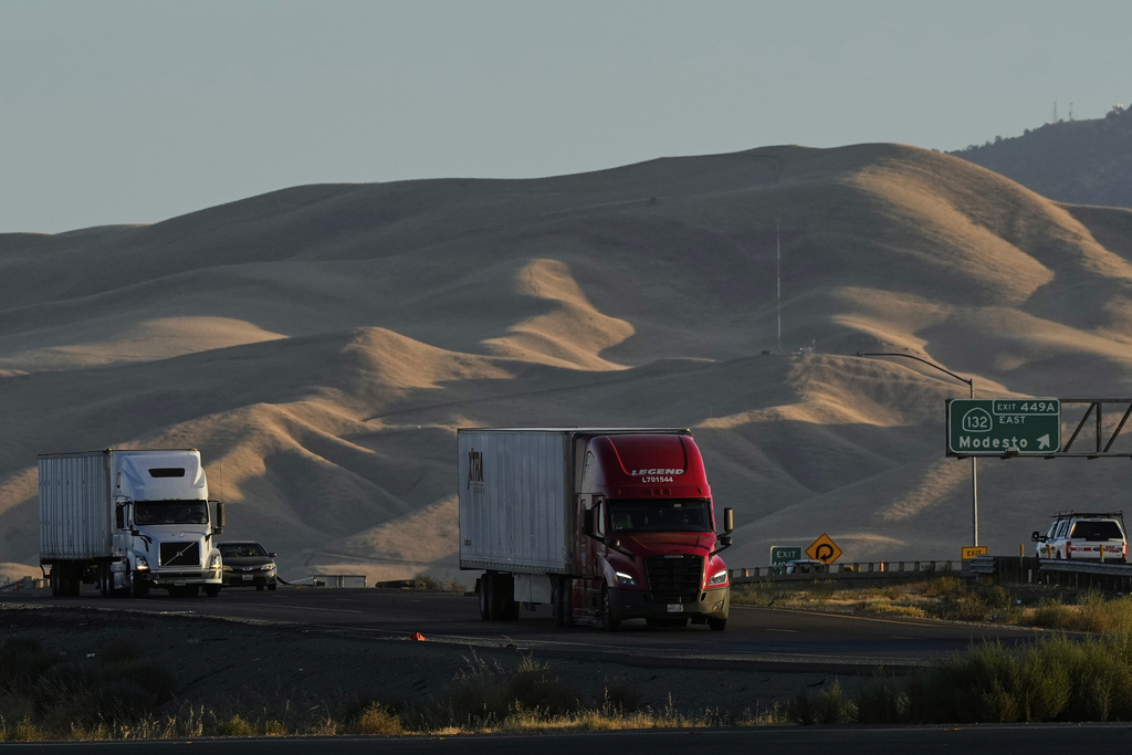 Freight trucks travel northbound on Interstate 5 Highway, Wednesday, Sept. 3, 2025, in Tracy, Calif. (AP Photo/Godofredo A. Vásquez)