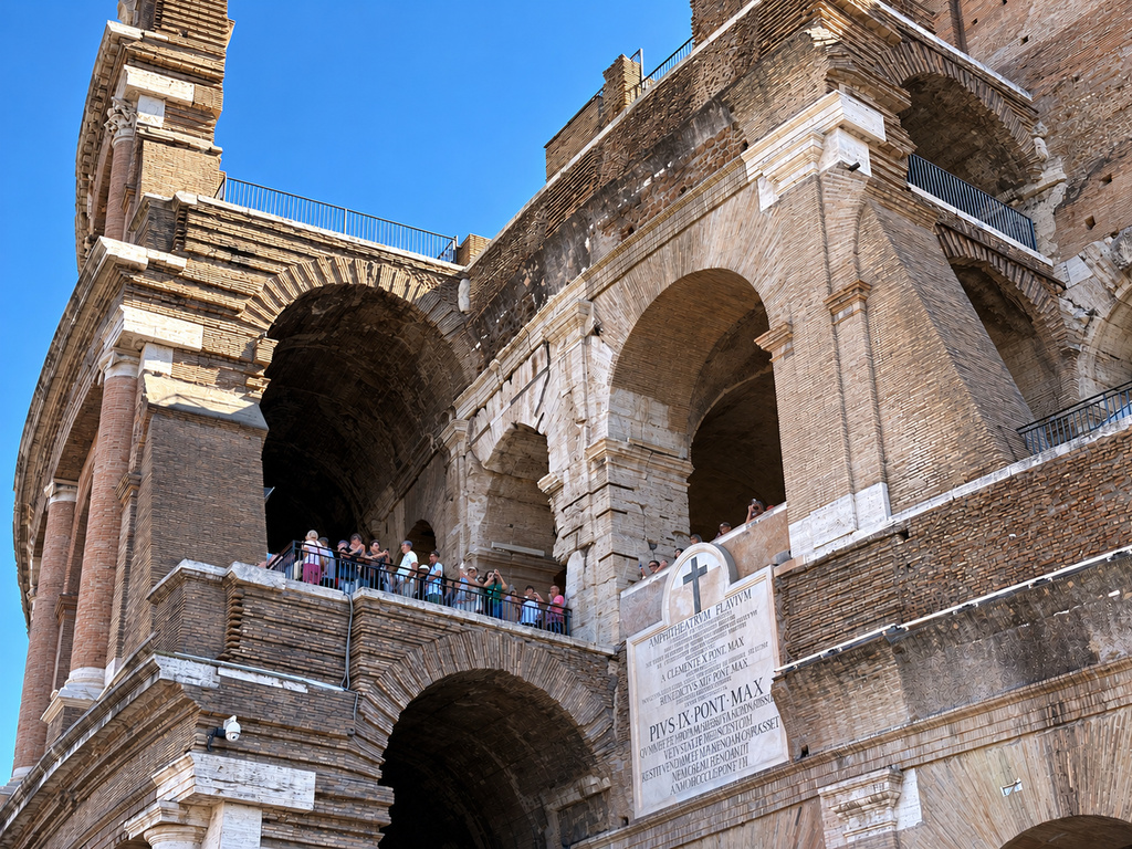 Tourists wait to leave the Colosseum, closed to the public for the day to mourn a worker who fell to his death late Tuesday while installing cabling inside the ancient amphitheater, in Rome, Wednesday, Sept. 23, 2026. (AP Photo/Domenico Stinellis)