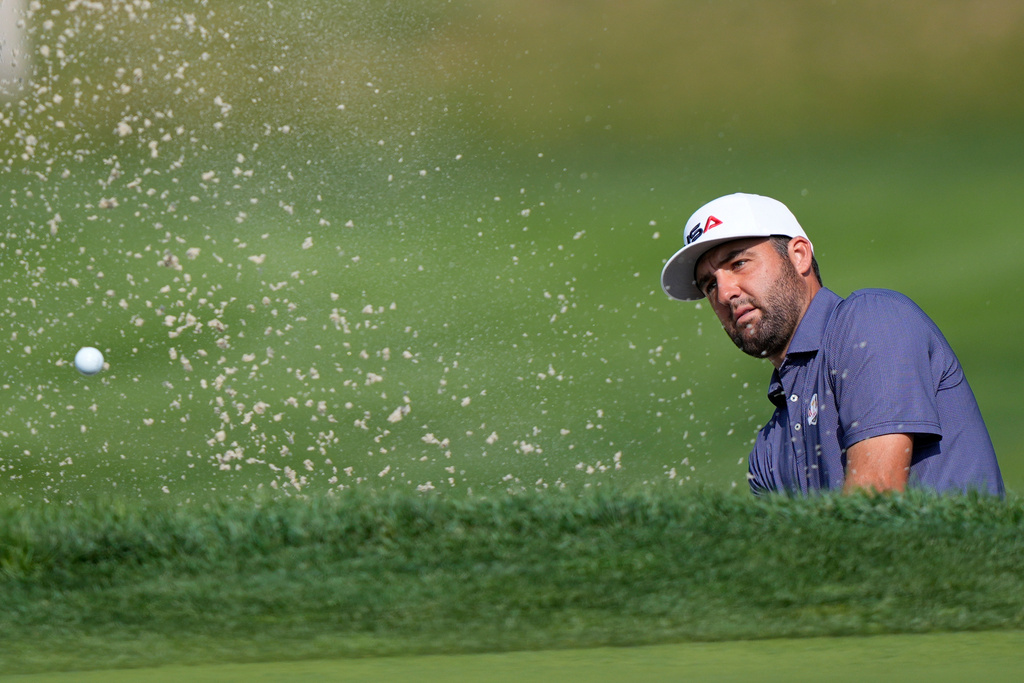 United States' Scottie Scheffler hits from the bunker on the 11th hole during a practice round for the Ryder Cup golf tournament, Tuesday, Sept. 23, 2025, in Farmingdale, N.Y., at Bethpage State Park's Black Course. (AP Photo/Robert Bukaty)