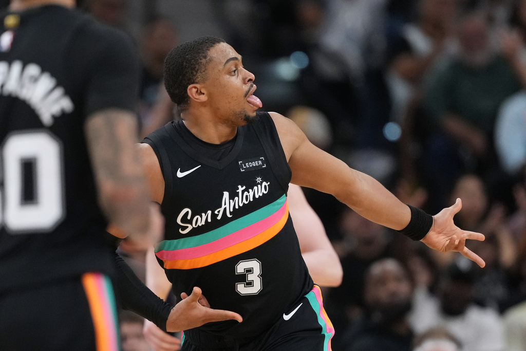 San Antonio Spurs forward Keldon Johnson (3) celebrates a score against the Los Angeles Lakers during the second half of an NBA basketball game in San Antonio, Wednesday, Jan. 7, 2026. (AP Photo/Eric Gay)