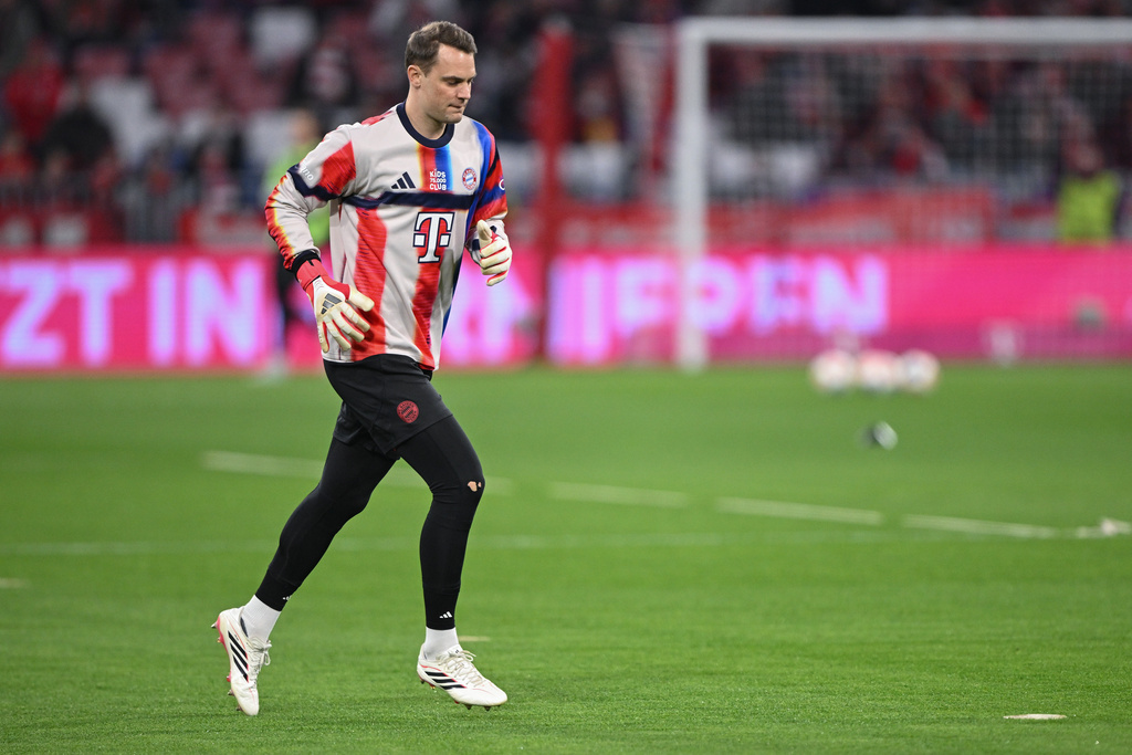 Bayern Munich goalkeeper Manuel Neuer warms up ahead of the Bundesliga soccer game between Bayern Munich and Mönchengladbach in Munich, Germany, Friday, March 6, 2026. (Harry Langer/dpa via AP)