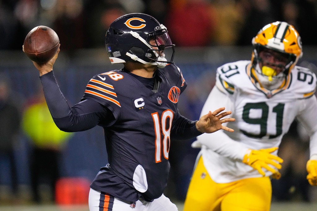 Chicago Bears' Caleb Williams throws with Green Bay Packers' Warren Brinson rushing during the second half of an NFL football game Saturday, Dec. 20, 2025, in Chicago. (AP Photo/Erin Hooley)