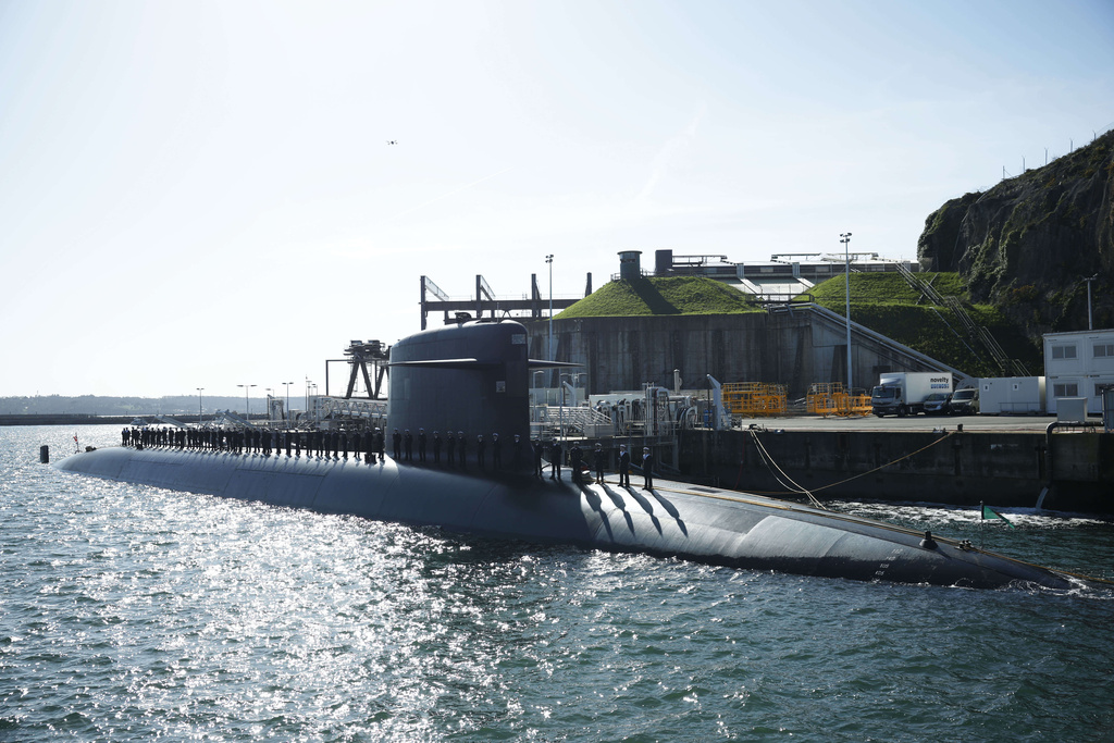 Sailors are aboard a submarine awaiting the arrival of French President Emmanuel Macron at the nuclear submarine navy base of Ile Longue in Crozon, France, Monday March 2, 2026. (Yoan Valat/Pool Photo via AP)