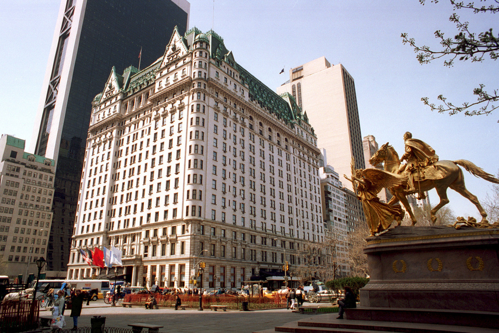 FILE - Pedestrians walk in front of the Plaza Hotel in New York, April 11, 1995. (AP Photo/Marty Lederhandler, File)