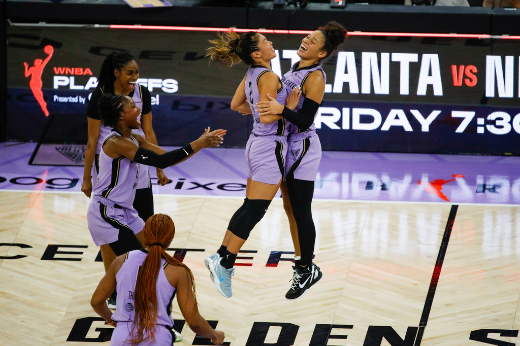 Golden State Valkyries guard Kaitlyn Chen (2) and Golden State Valkyries guard Veronica Burton (22) celebrate their win against the Las Vegas Aces during Game 2 of the WNBA Semifinals in San Francisco, Wednesday, Oct. 7, 2026. (Yalonda M. James/San Francisco Chronicle via AP)