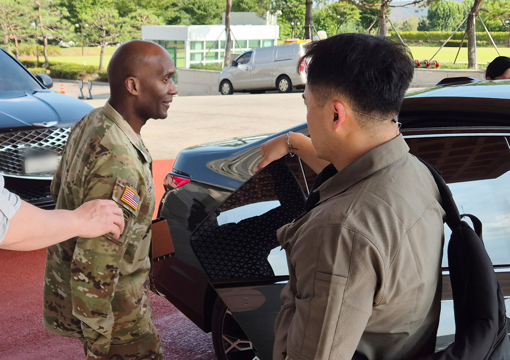 Gen. Xavier Brunson, commander of U.S. Forces Korea, left, leaves the Defense Ministry in Seoul, South Korea, Tuesday, Aug. 18, 2026. (Kim Chul-sun/Yonhap via AP)