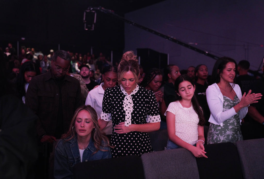 Girls Gone Bible podcasters, Angela Halili, left, and Arielle Reitsma, attend 2819 Church on Sunday, Nov. 16, 2025, in Atlanta. (AP Photo/Jessie Wardarski)