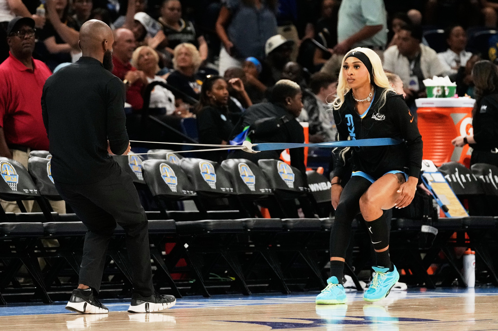 Chicago Sky guard-forward DiJonai Carrington, right, warms up before a WNBA basketball game against the Indiana Fever Sunday, Aug. 23, 2026, in Chicago. (AP Photo/Nam Y. Huh)
