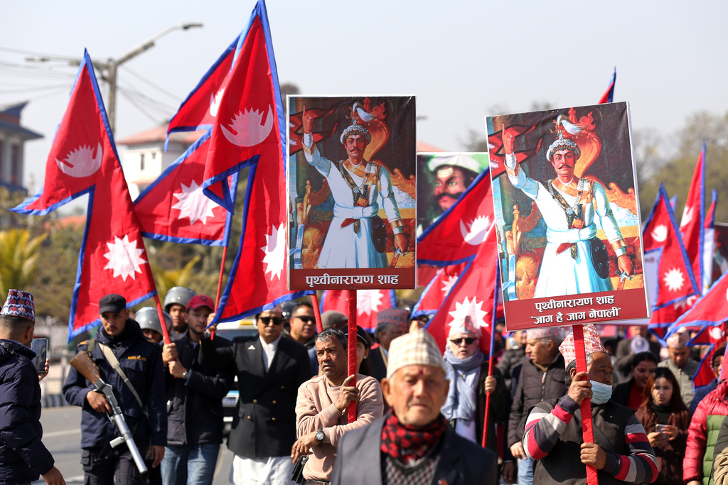 Supporters of Nepal's former royal family participate in a rally demanding the restoration of the monarchy as they mark the birth anniversary of the 18th century king Prithivi Narayan Shah, founder of the Shah dynasty, in Katmandu, Nepal, Sunday, Jan. 11, 2026. (AP Photo/Subash Shrestha)