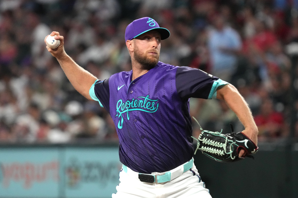 Arizona Diamondbacks pitcher Merrill Kelly throws against the St. Louis Cardinals in the first inning of a baseball game, Friday, July 17, 2026, in Phoenix. (AP Photo/Rick Scuteri)