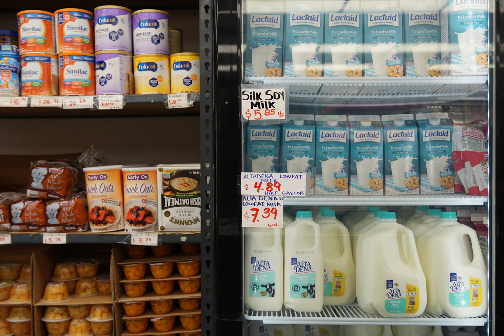 Pantry staples, including infant formula and dairy products, are sold at a market serving the Central American immigrant community in the Westlake/Pico Union area of Los Angeles, Tuesday, April 7, 2026. (AP Photo/Damian Dovarganes)