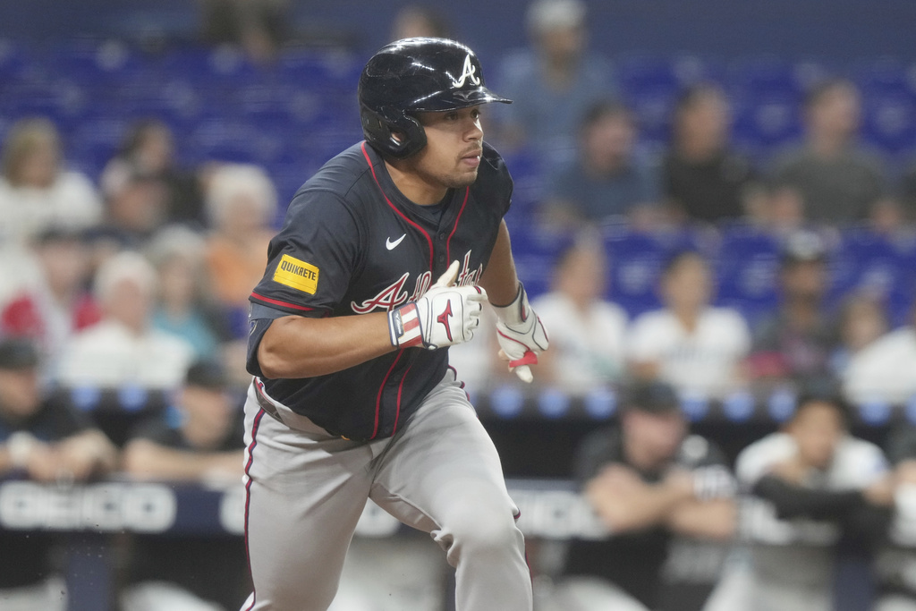 Atlanta Braves' Drake Baldwin runs to first base after hitting a single to right field during the ninth inning of a baseball game against the Miami Marlins, Tuesday, Aug. 26, 2025, in Miami. (AP Photo/Marta Lavandier)