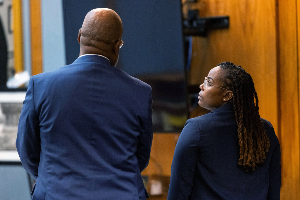 Ebony Parker, right, speaks with her attorney, Curtis M. Rogers, during pretrial motions for her trial on felony child neglect charges at the Newport News Circuit Court in Newport News, Va., Monday, May 18, 2026. (Peter Casey/The Virginian-Pilot via AP, Pool)
