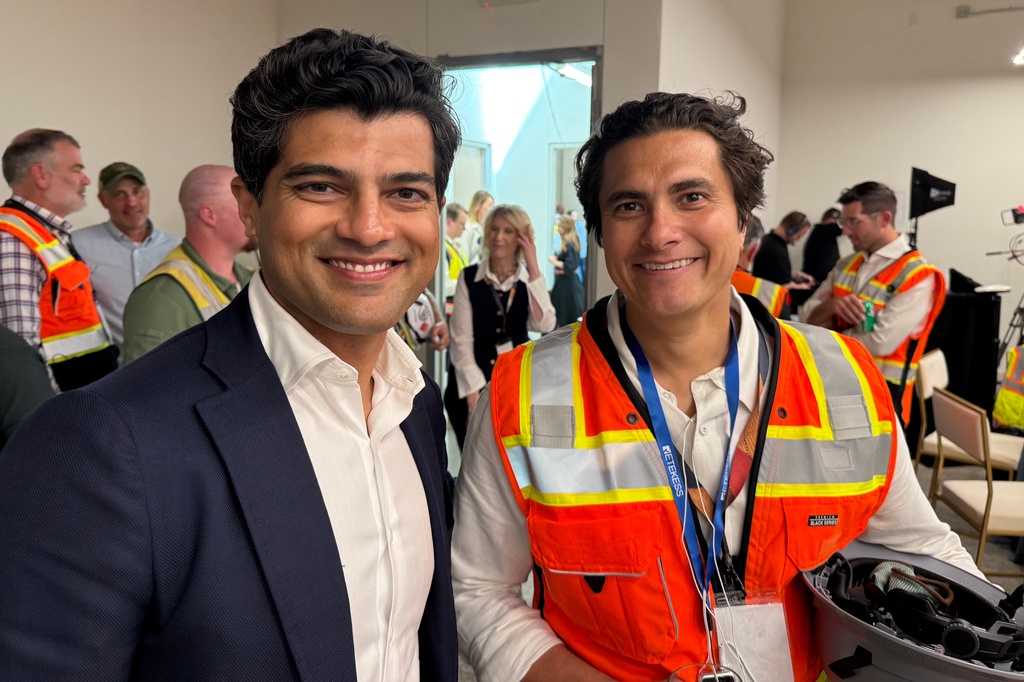 FILE - Vikas Parekh, managing partner at SoftBank Investment Advisers, at left, and Crusoe CEO Chase Lochmiller, at right, at the Stargate artificial intelligence data center campus in Abilene, Texas, on Sept. 23, 2025. (AP Photo/Matt O'Brien, File)