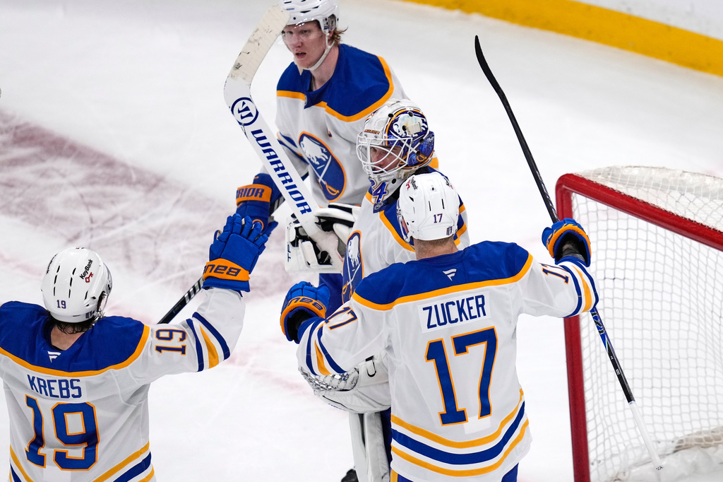 Buffalo Sabres goaltender Alex Lyon celebrates with teammates after their team eliminated the Boston Bruins from the playoffs in Game 6 of a first-round NHL hockey Stanley Cup playoff series, Friday, May 1, 2026, in Boston. (AP Photo/Charles Krupa)