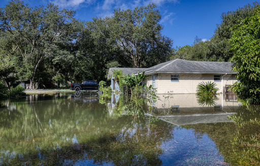 Water surrounds a flooded house at the intersection of Wolf Branch Road and Division Street, Monday, Oct. 27, 2025 in Mt. Dora, Fla. (Ricardo Ramirez Buxeda/Orlando Sentinel via AP) Water surrounds a flooded house at the intersection of Wolf Branch Road and Division Street, Monday, Oct. 27, 2025 in Mt. Dora, Fla. (Ricardo Ramirez Buxeda/Orlando Sentinel via AP)