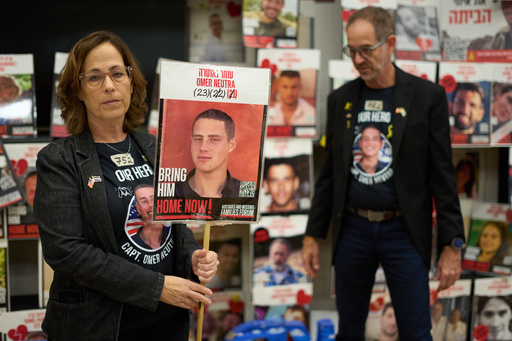 Ronen and Orna Neutra, parents of Omer Neutra, a U.S.-Israeli citizen who was killed in the Hamas-led attacks on Oct. 7, 2023, present a photo of their son in Tel Aviv, Israel, Monday, Oct. 27, 2025. (AP Photo/Ariel Schalit) Ronen and Orna Neutra, parents of Omer Neutra, a U.S.-Israeli citizen who was killed in the Hamas-led attacks on Oct. 7, 2023, present a photo of their son in Tel Aviv, Israel, Monday, Oct. 27, 2025. (AP Photo/Ariel Schalit)