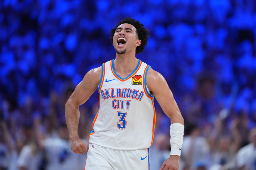Oklahoma City Thunder guard Jared McCain (3) reacts to a basket against the San Antonio Spurs in the second half of Game 5 in the Western Conference finals NBA basketball playoffs series, Tuesday, May 26, 2026, in Oklahoma City. (AP Photo/Julio Cortez)