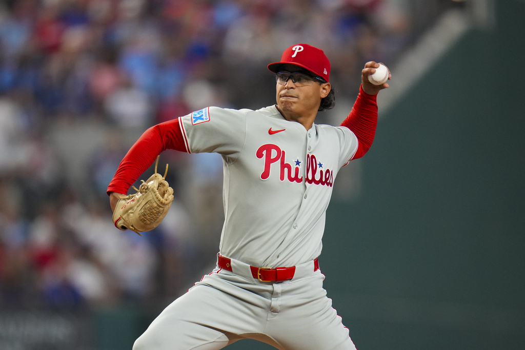 Philadelphia Phillies starting pitcher Jesús Luzardo throws to the Texas Rangers during the first inning of a baseball game Saturday, Aug. 9, 2025, in Arlington, Texas. (AP Photo/Julio Cortez)
