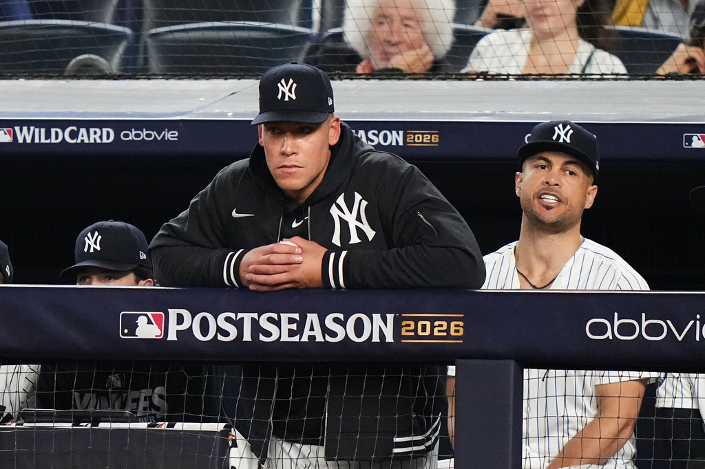 New York Yankees' Aaron Judge, left, and Giancarlo Stanton, right, watch from the dugout during the ninth inning against the Boston Red Sox in Game 2 of baseball's American League Wild Card Series, Wednesday, Sept. 30, 2026, in New York. (AP Photo/Frank Franklin II)