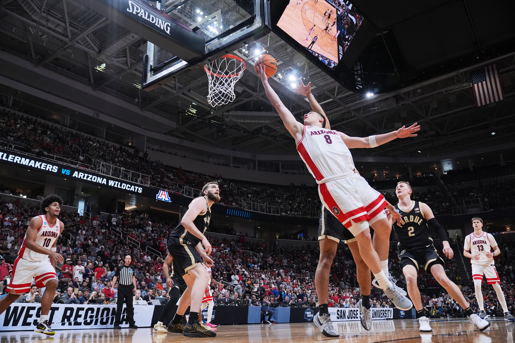 Arizona forward Ivan Kharchenkov (8) drives to the basket against Purdue during the first half in the Elite Eight of the NCAA college basketball tournament, Saturday, March 28, 2026, in San Jose, Calif. (AP Photo/Godofredo A. Vásquez)