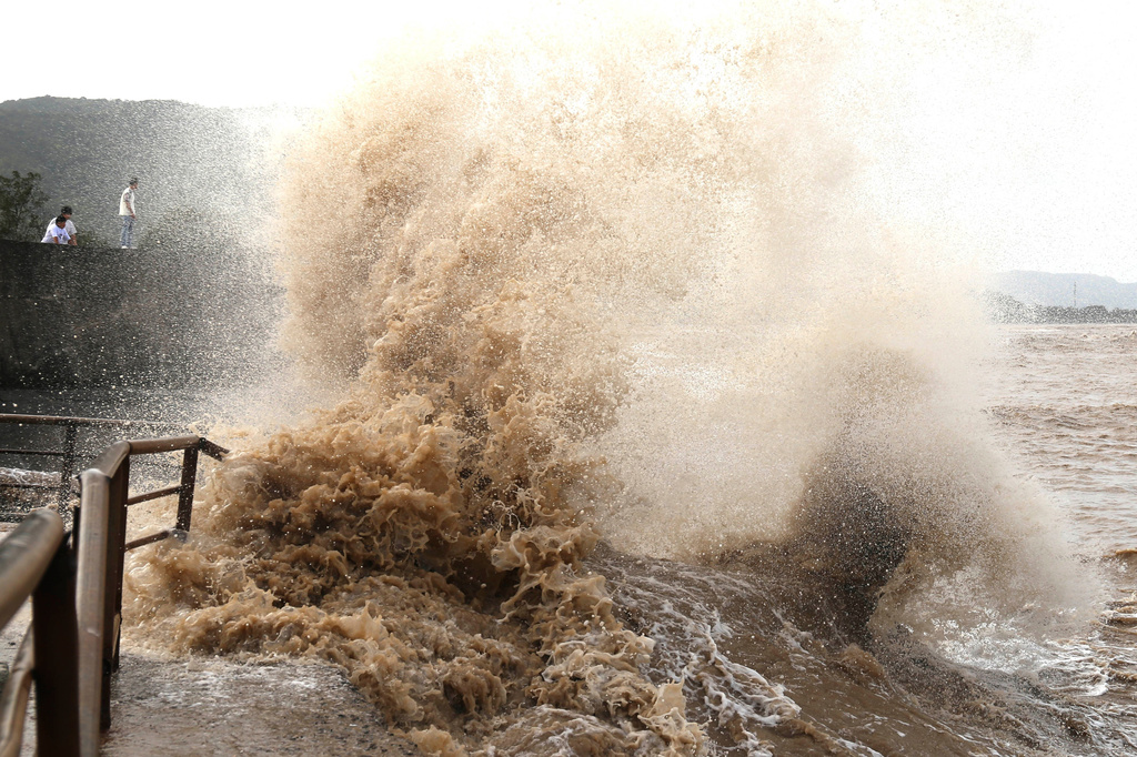 Huge waves crash on the coastline ahead of Typhoon Bavi in Wenling in eastern China's Zhejiang province, Friday, July 10, 2026. (Chinatopix Via AP) CHINA OUT