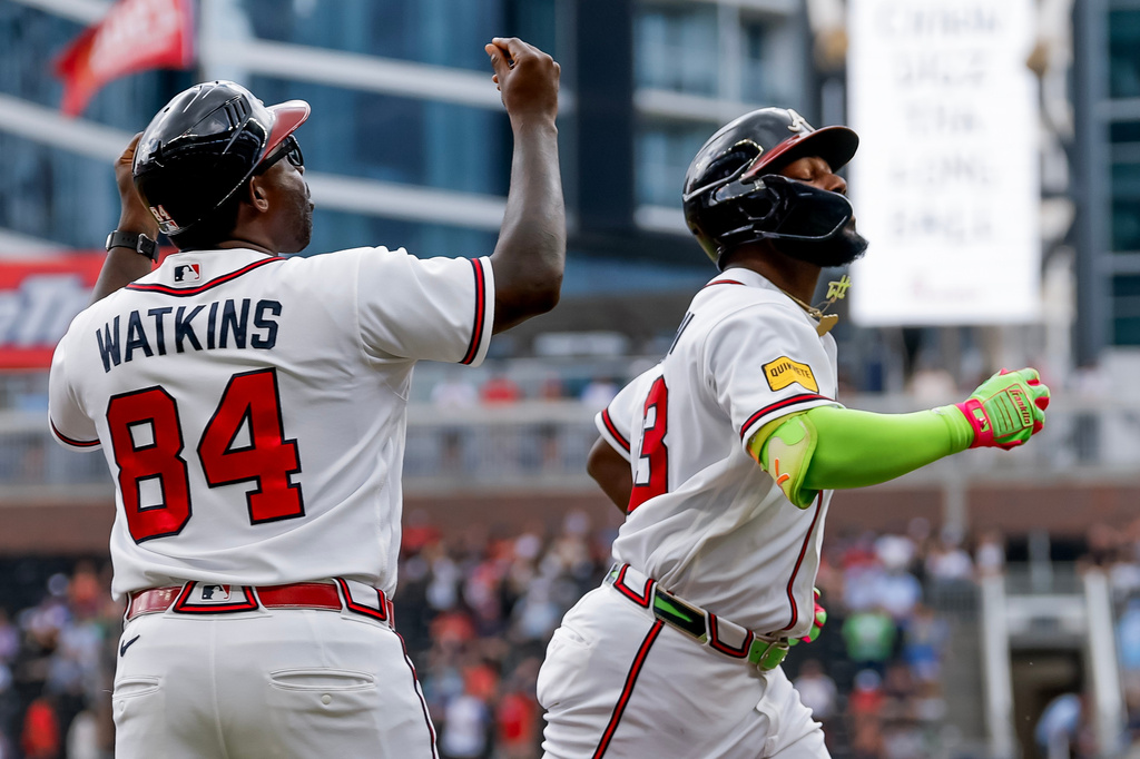 Atlanta Braves' Michael Harris II, right, reacts with third base coach Tommy Watkins (84), after hitting a solo home run against the San Diego Padres during the second inning of a baseball game, Thursday, July 23, 2026, in Atlanta. (AP Photo/Erik S. Lesser)
