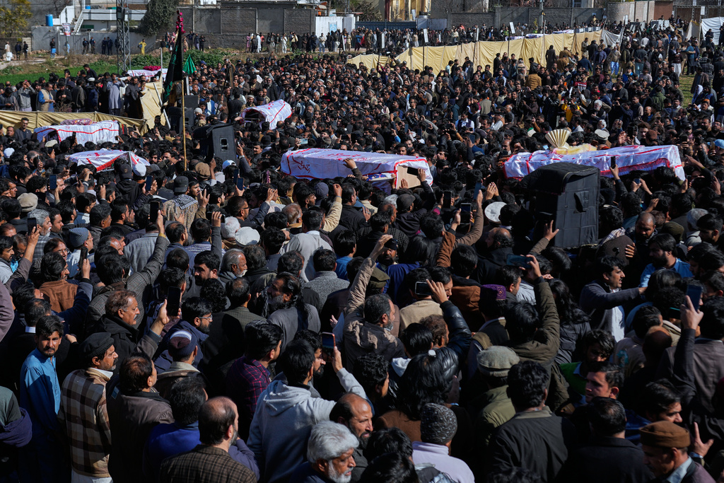 Mourners carry coffins of the victims of Friday's suicide bombing inside a Shiite mosque, after a funeral prayer, in Islamabad, Pakistan, Saturday, Feb. 7, 2026. (AP Photo/Anjum Naveed)