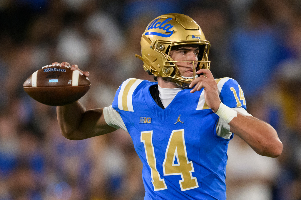 UCLA quarterback Ty Dieffenbach (14) throws a pass during the second half of an NCAA college football game against Wisconsin Saturday, Oct. 17, 2026, in Pasadena, Calif. (AP Photo/Kyusung Gong)