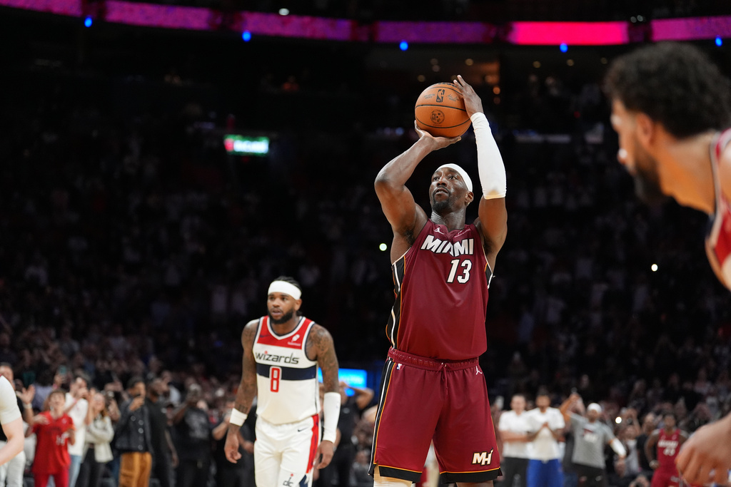 Miami Heat center Bam Adebayo (13) shoots a free throw to reach 83 points, the second-highest single game total in NBA history, in the second half of an NBA basketball game against the Washington Wizards, Tuesday, March 10, 2026, in Miami. (AP Photo/Rebecca Blackwell)